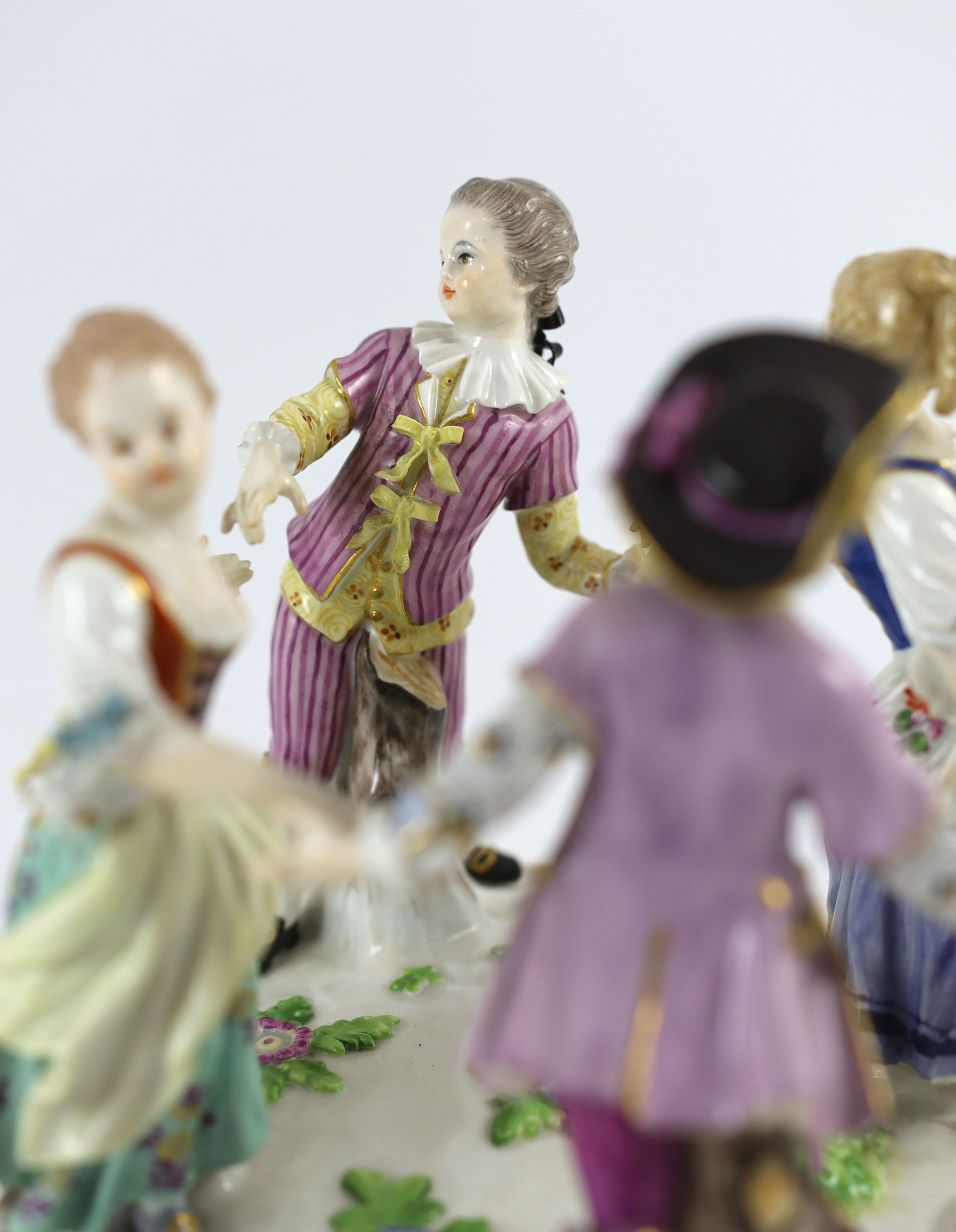 A Meissen group of four dancing children, early 20th century, 15 cm high
